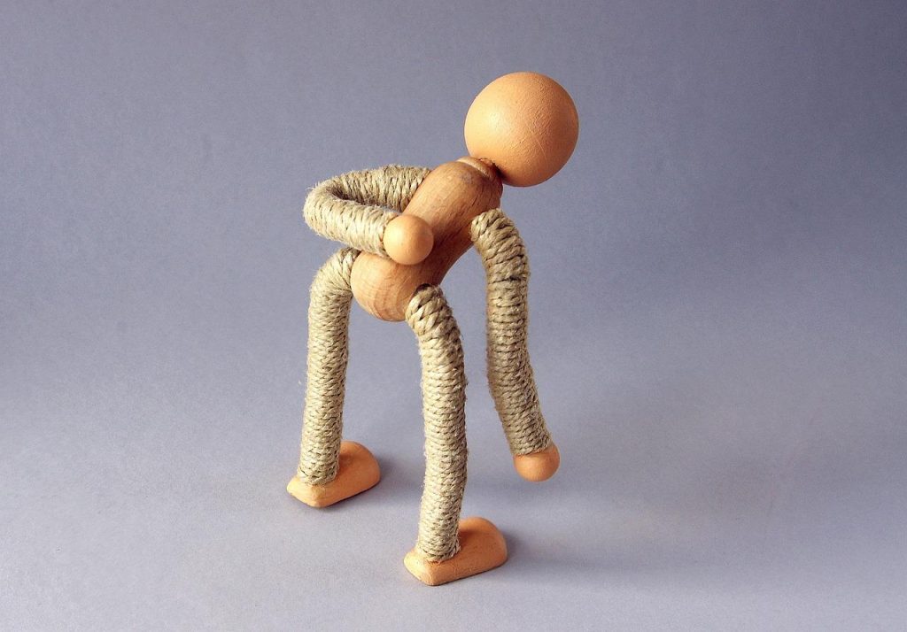 Illustratie van osteopathische behandeling voor beknelde zenuw in de rug met focus op zenuwcompressie